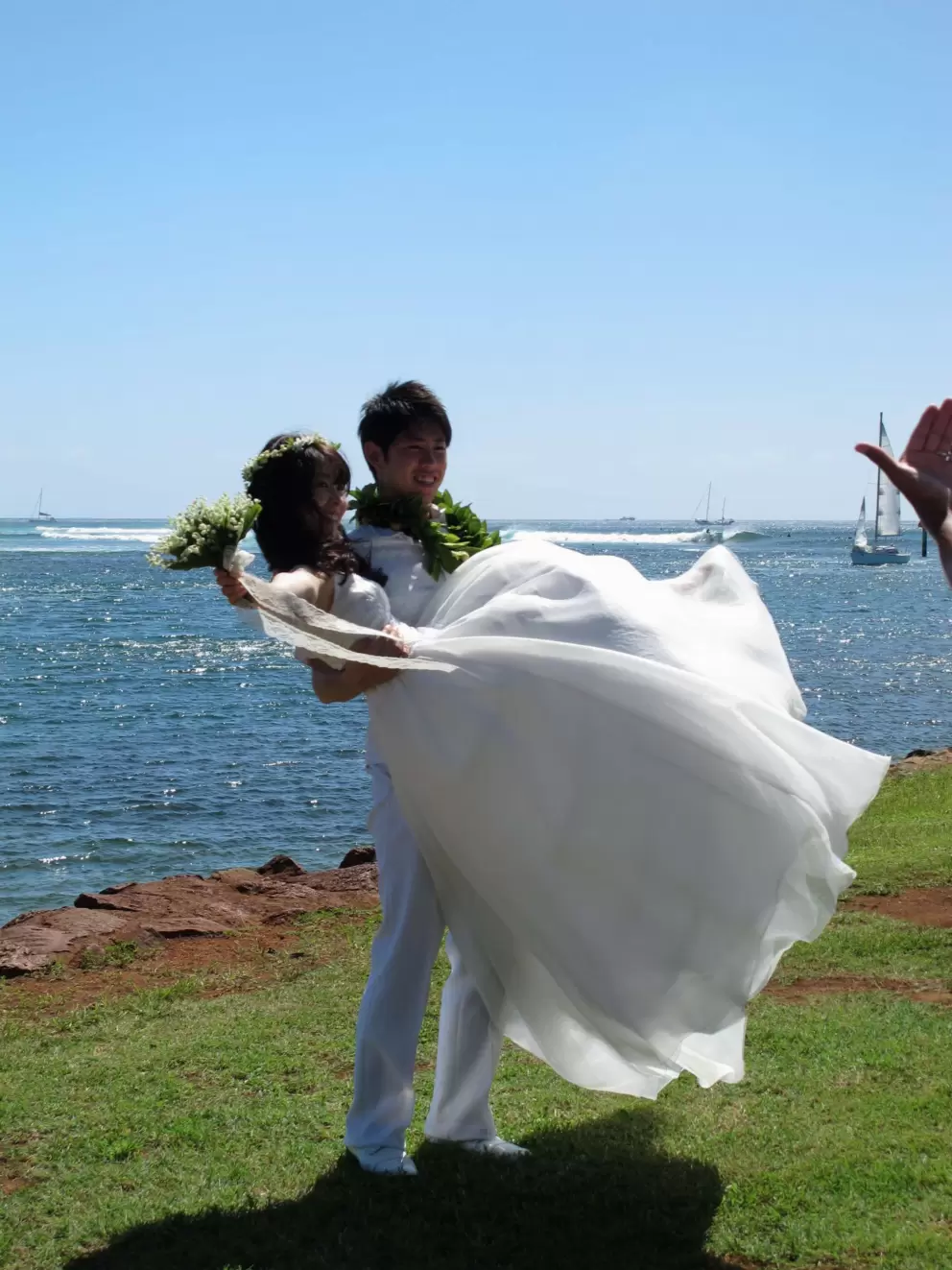 Japanese bride and groom being photographed at Magic Island.