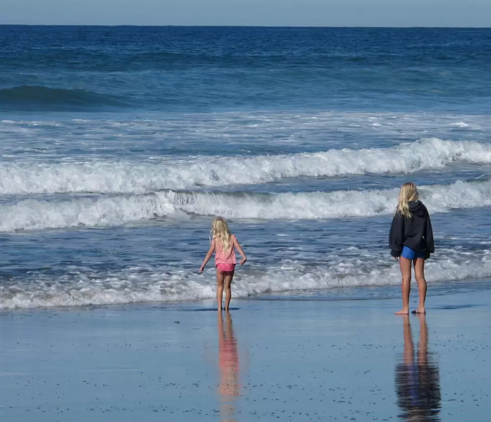 Sisters watching the waves come in.