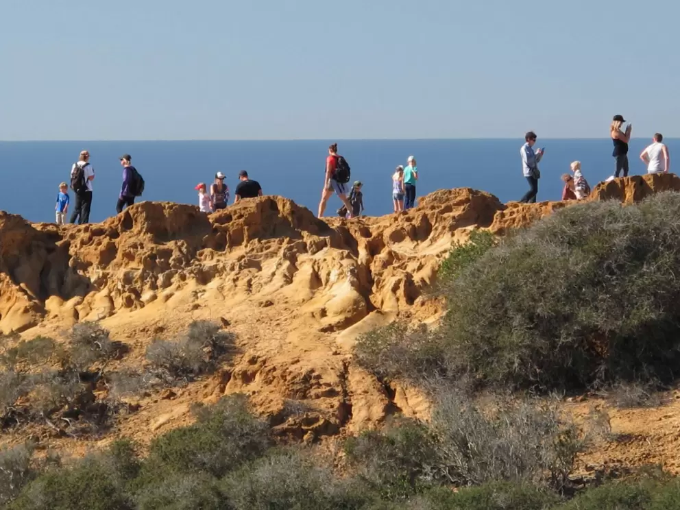 Hikers enjoying the view at the end of the West Overlook Trail.