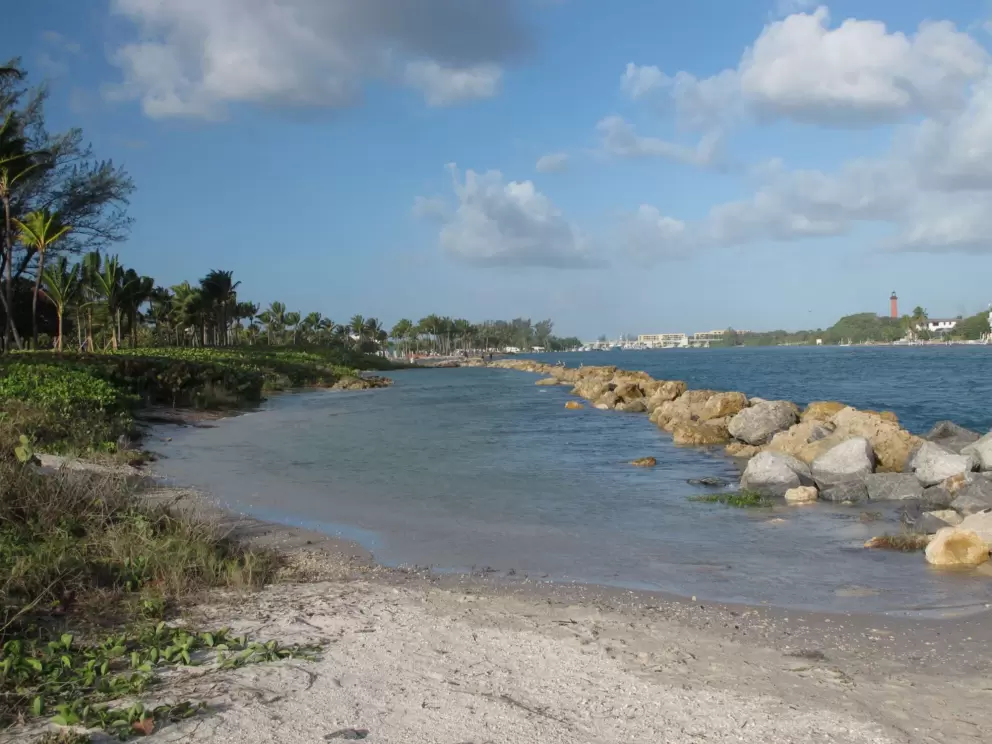 Shallow pool of water beside the inlet. 