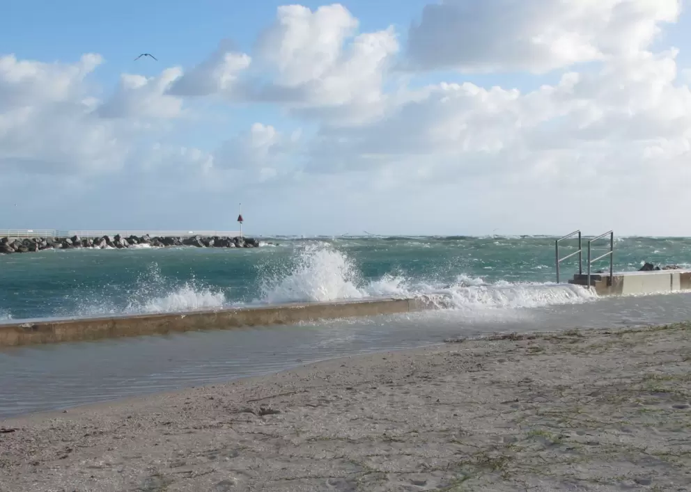 Water rushes over the wall on a stormy November morning.