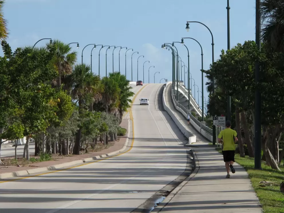 The attractive causeway that leads from the town to the beach.