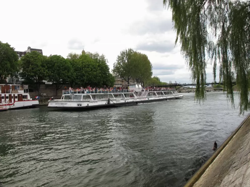 Watching the tourist boats go by.