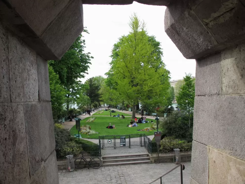 Looking through a window in the bridge, at the park below.