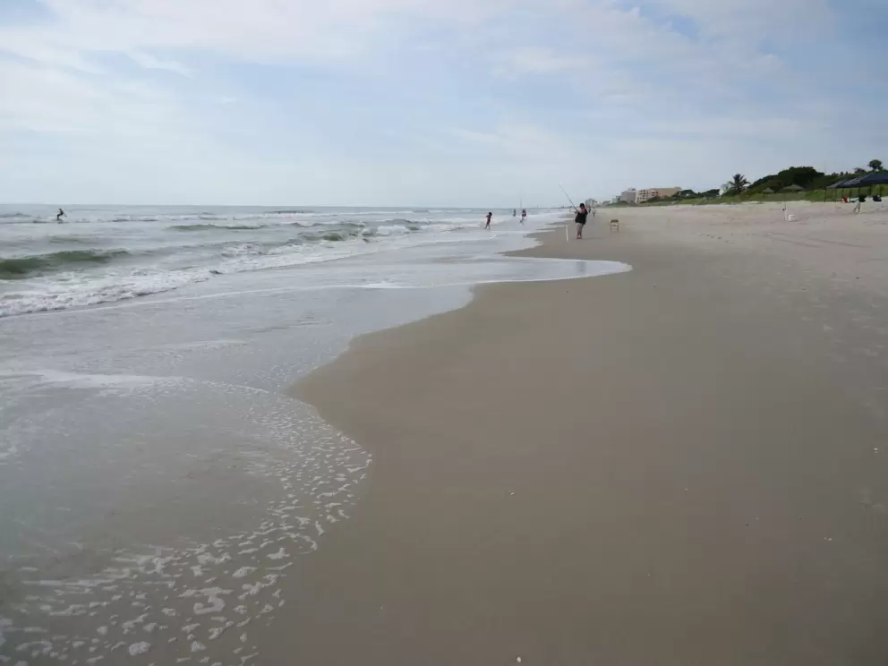 The wide expanse of sand.