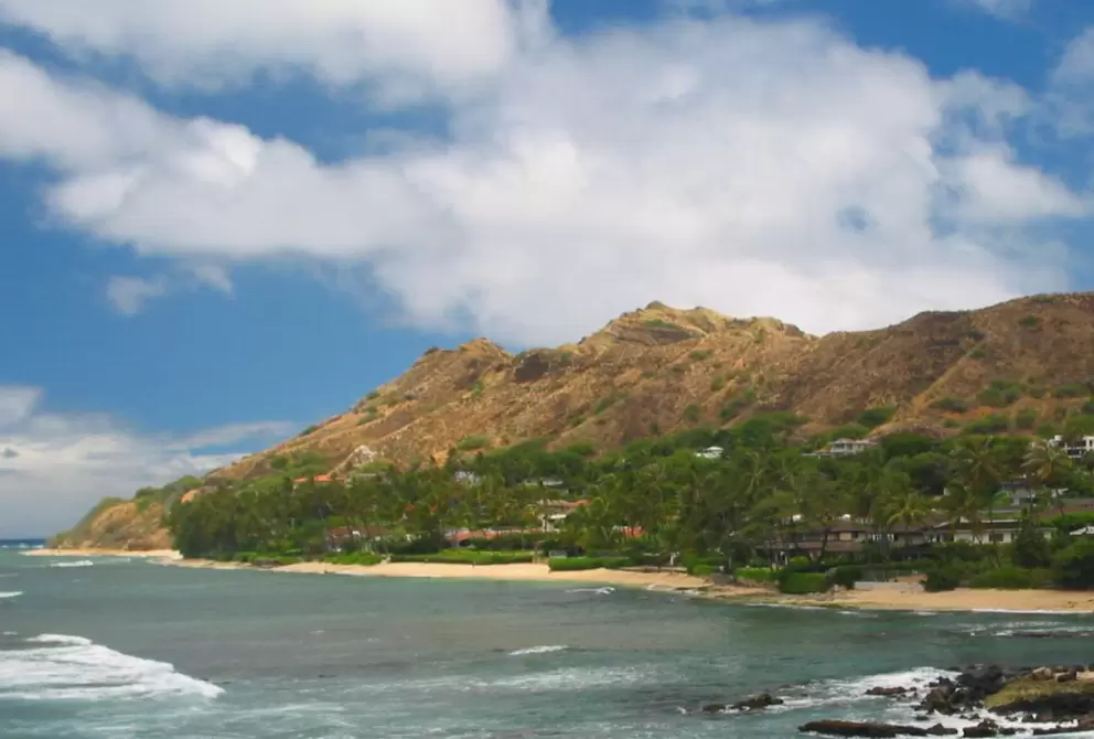 If you walk a while around the sand to the left after descending down to Diamond Head Beach, you will find these great swimming beaches.