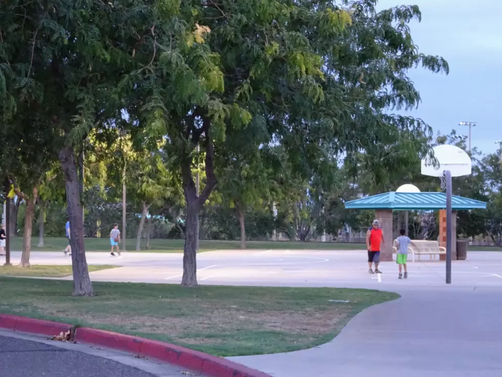 Basketball courts on a summer evening.