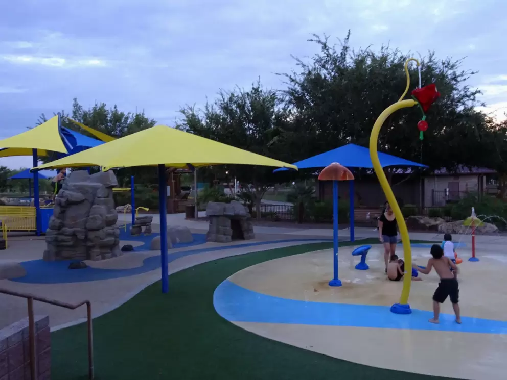 Having fun at the splash pad after sundown.