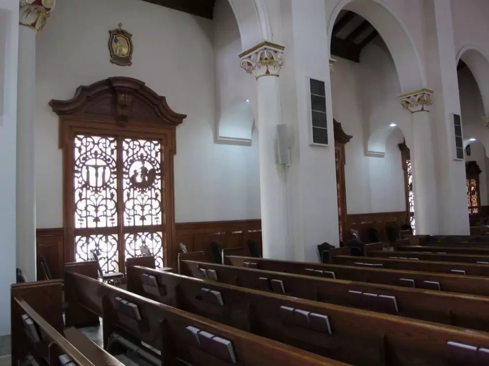 Say a prayer inside Church of the Little Flower.
