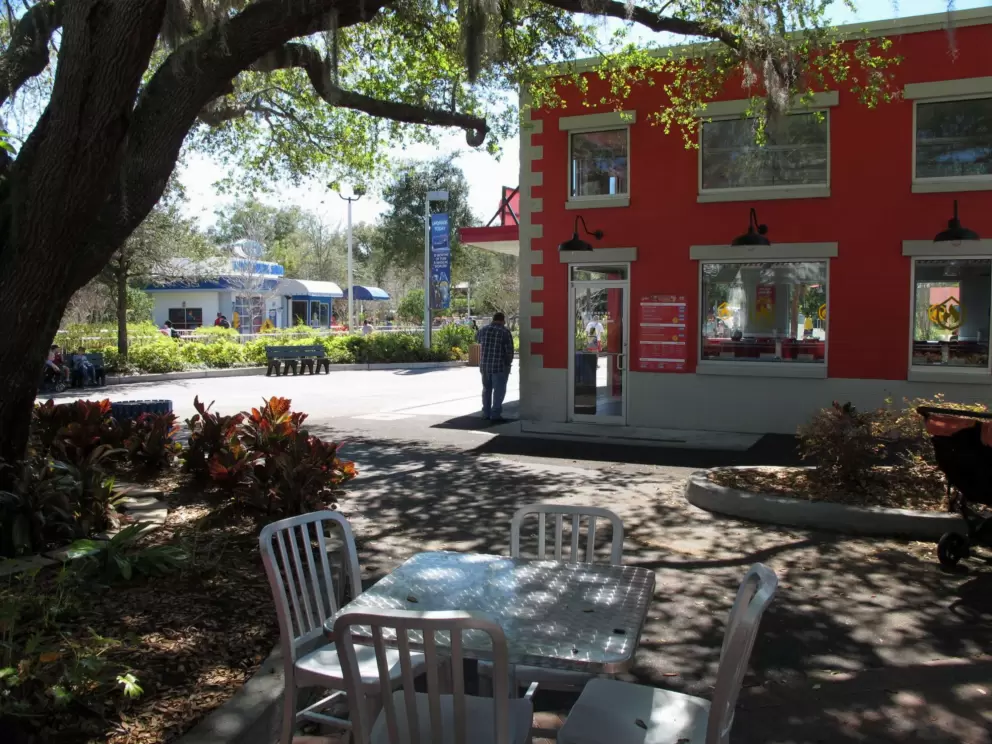 A shady spot to sit outside a cafe.