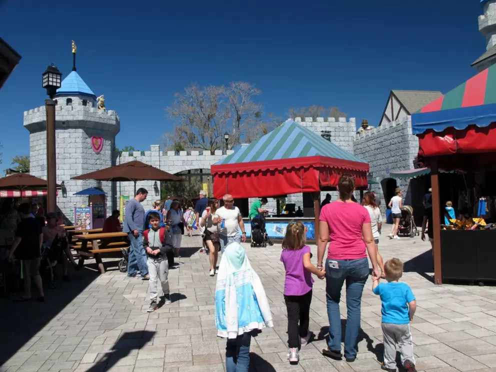 A family walks around in the medieval land.