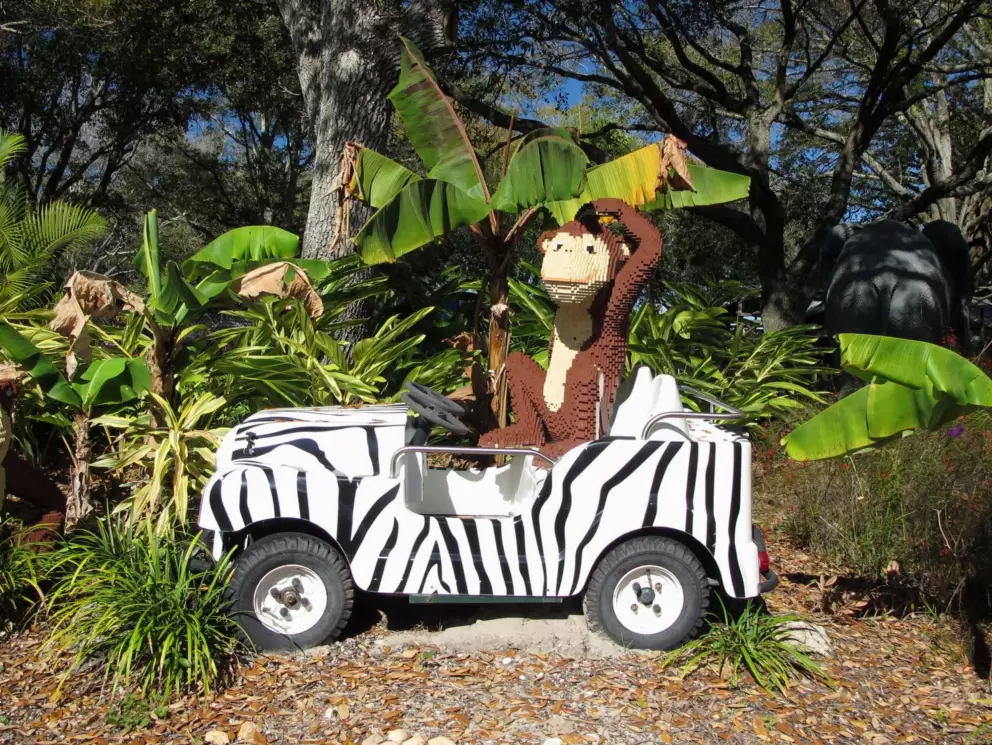 Safari jeep and monkey made of lego.