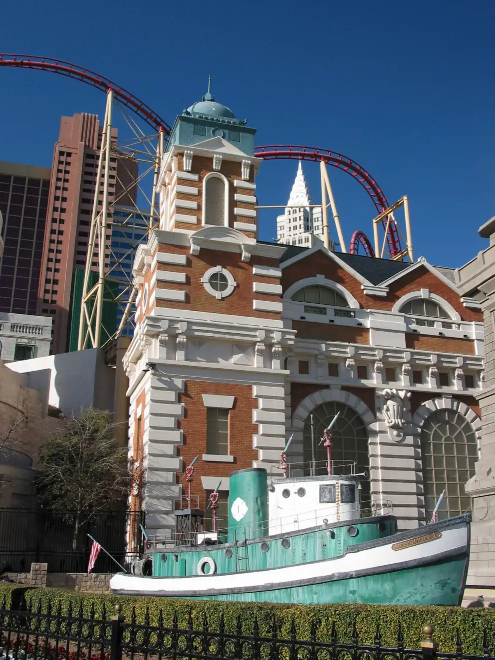 "Boat" in "harbor" outside New York New York Hotel, plus rollercoaster that winds its way around the buildings.