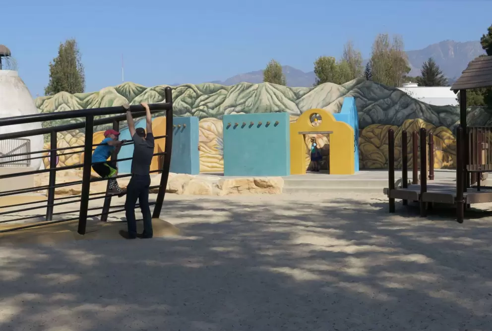 The sandy part of the playground.