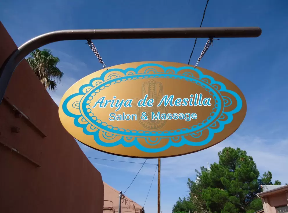 Cute golden and turquoise sign in front of a spa.