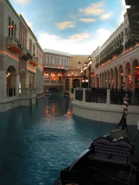 Gondola, canal, and gorgeous buildings.