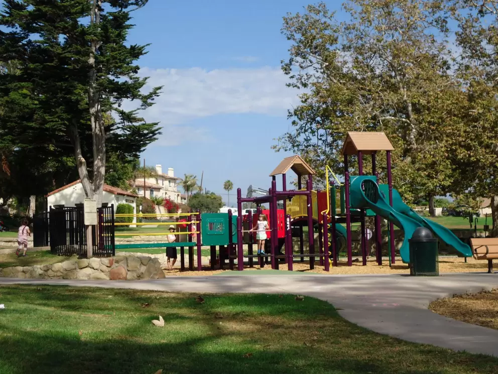 The colorful playground and beautiful trees!