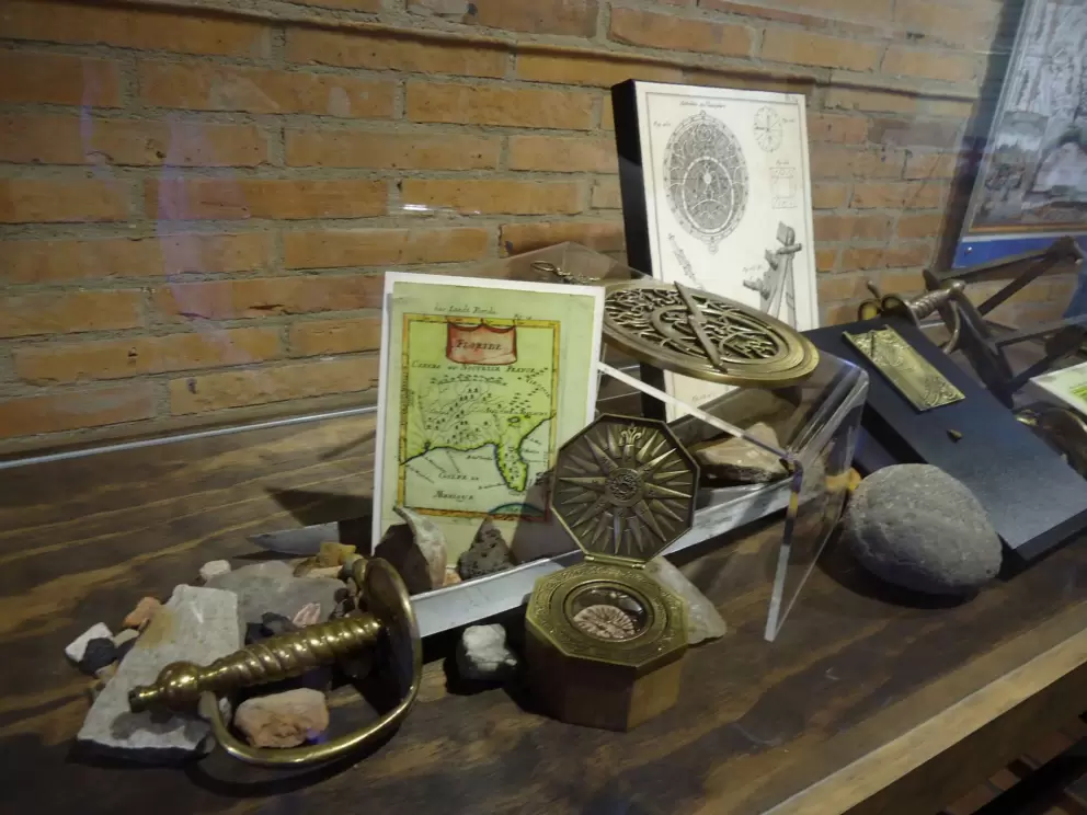 Sword, compass, and maps.