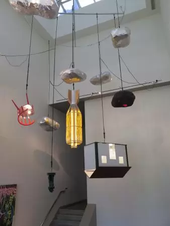Interesting art hanging from the ceiling above the stairwell.
