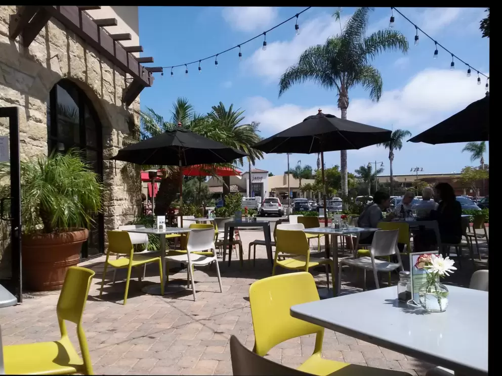 The colorful seating outside Natural Cafe, a great place to eat lunch or dinner!