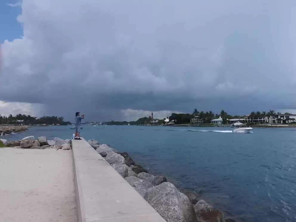 Huge storm cloud gathering over the lighthouse.