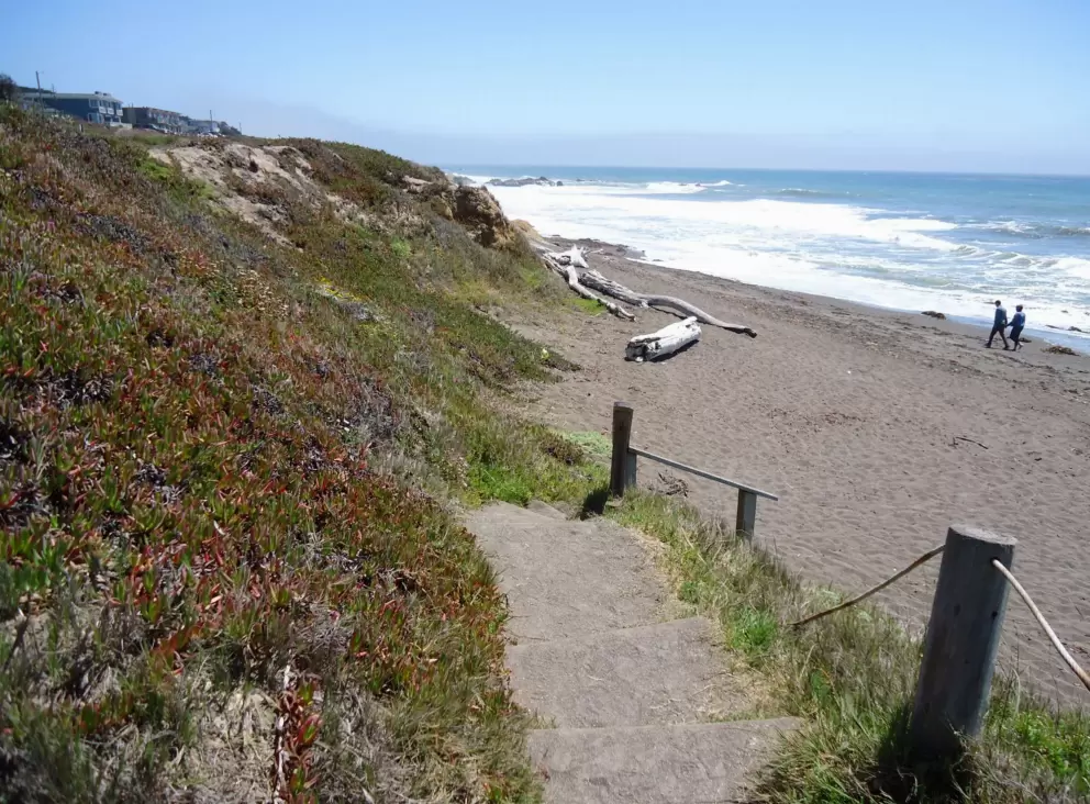 Stairs down to the sand.