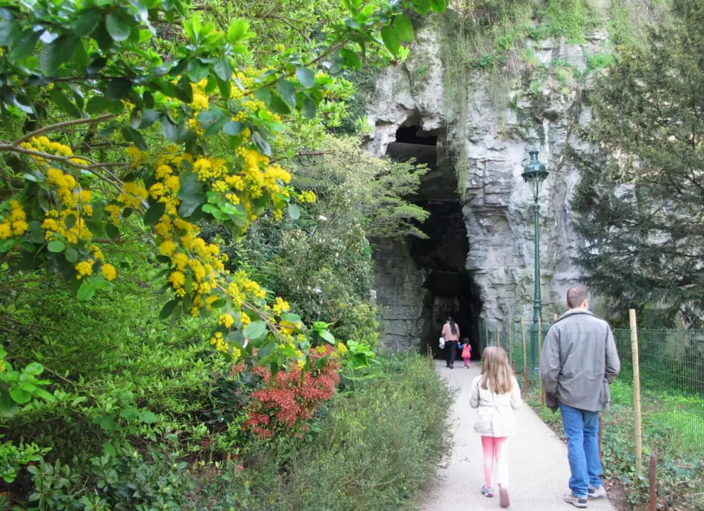 Walking toward a tall cave.