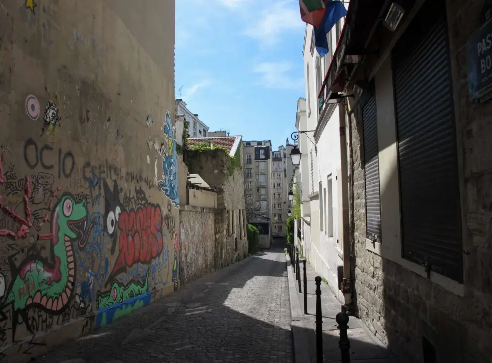 Graffiti on a narrow street.