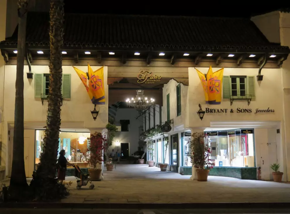 The entrance to El Paseo, at night.