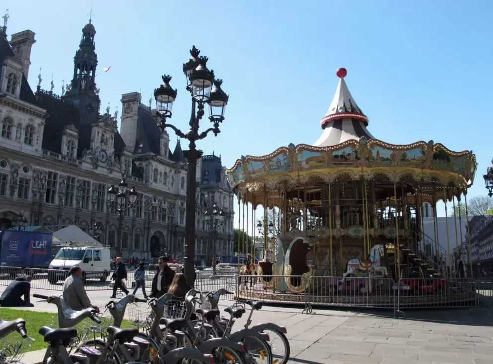 The two-storey carousel in front of the gorgeous Hotel de Ville, nearby.
