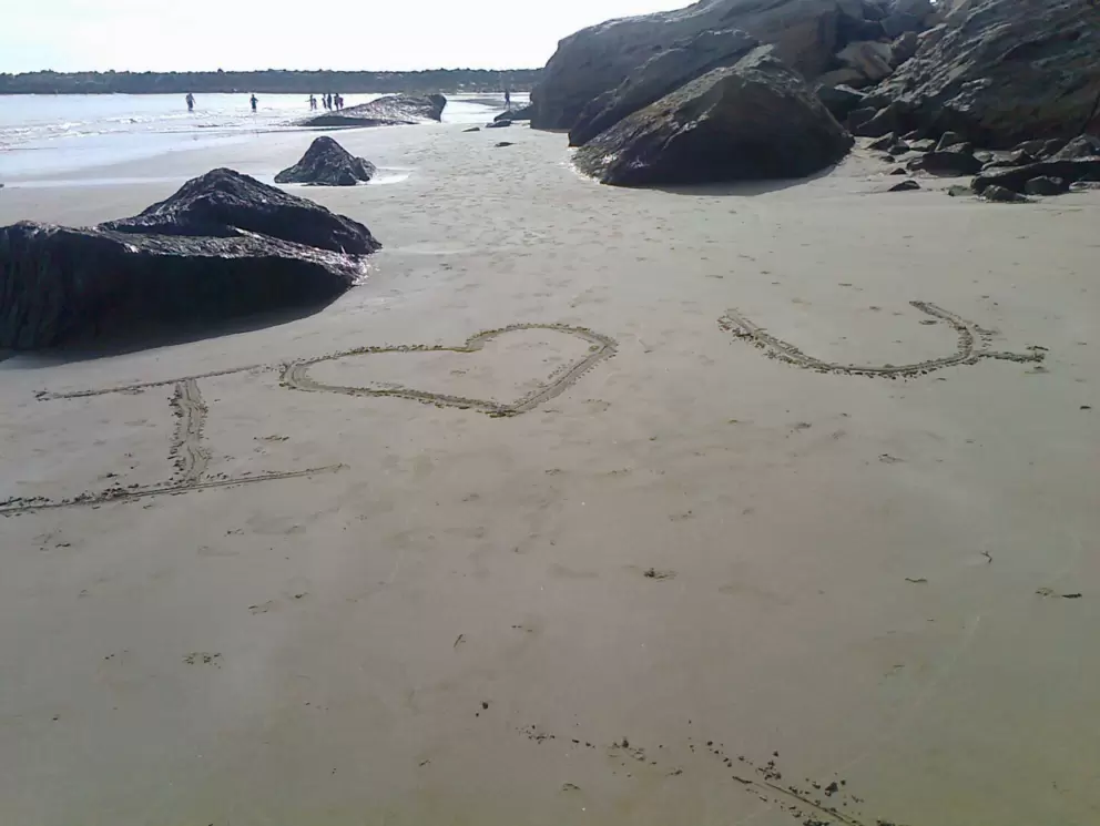 I Love You in the sand, at the beach at the end of the Harborwalk, below the huge Morro Rock.