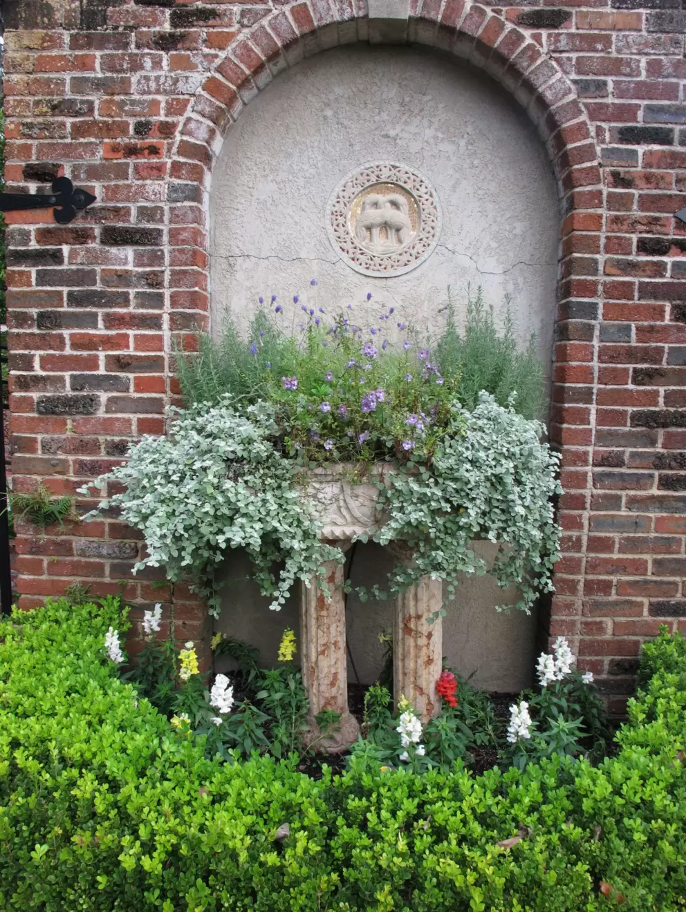 Planter and brick arch.
