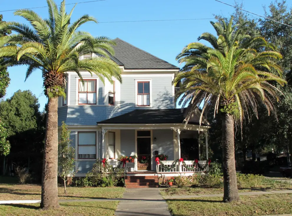 Nice palm trees and historic house.