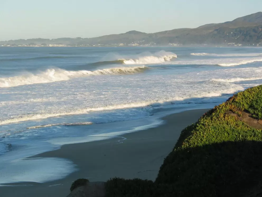 View of curling waves and spray, from Poplar Beach cliffs.