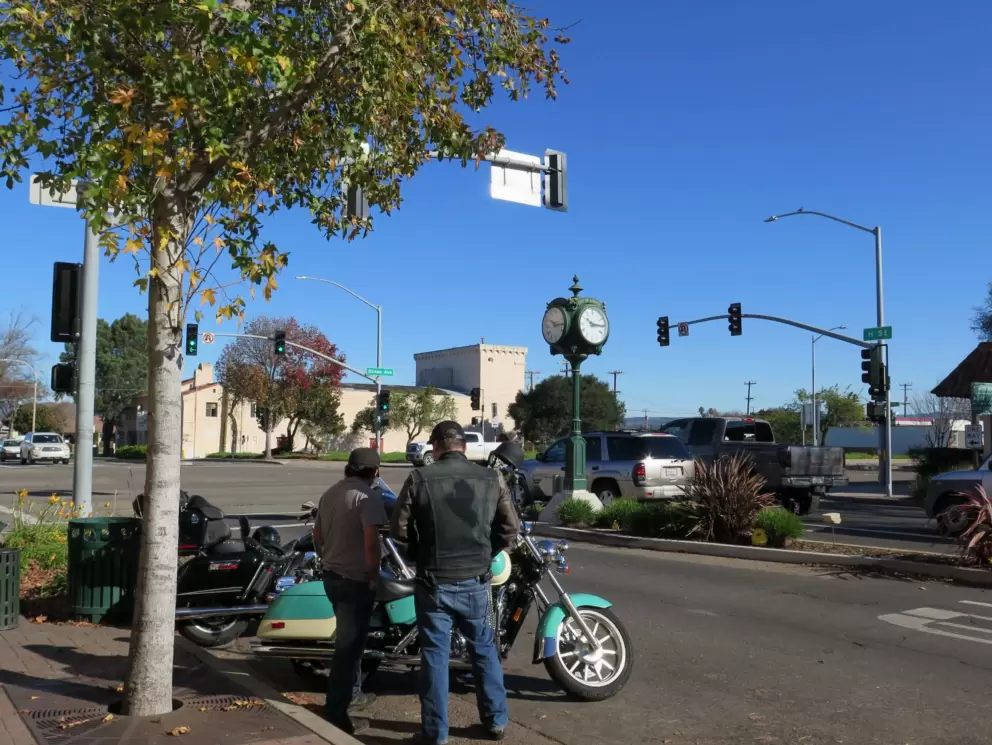 Bikers and clocktower on H Street.