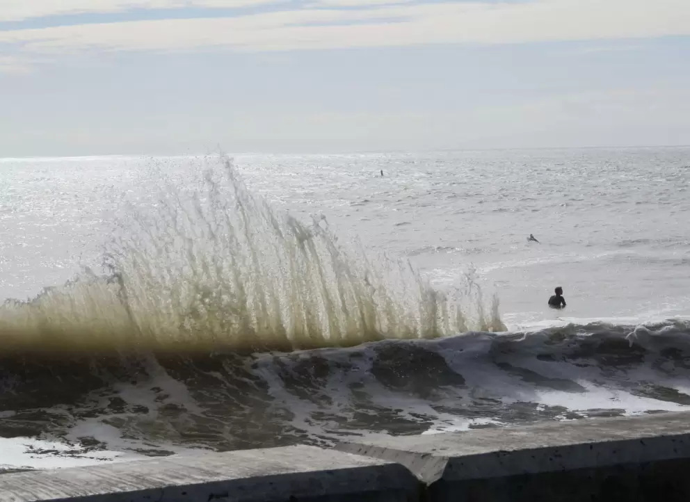 Crazy wave by the seawall, on a high surf day.