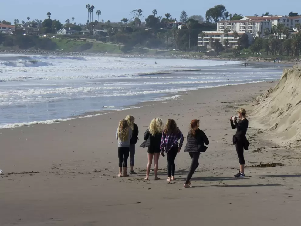 Girls on Leadbetter Beach, as seen from the breakwater.