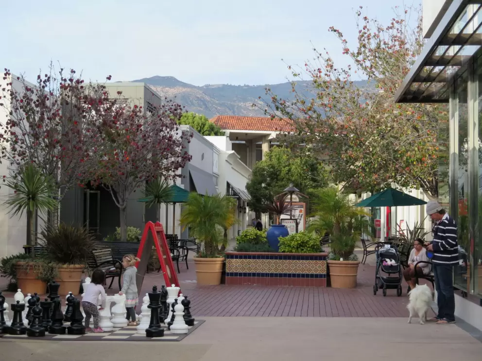Little girls playing at the chess board.