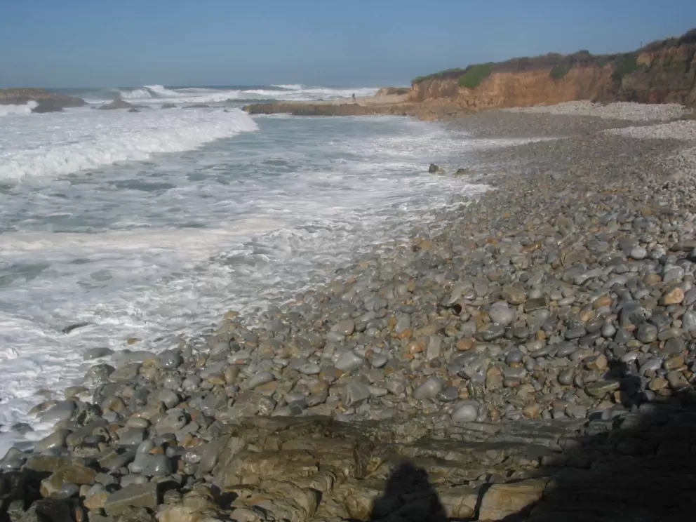 The gorgeous pebbly beach to the right of the jetty.