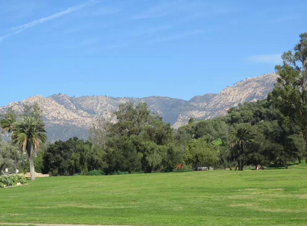 The mission gardens, lawn, and mountains.