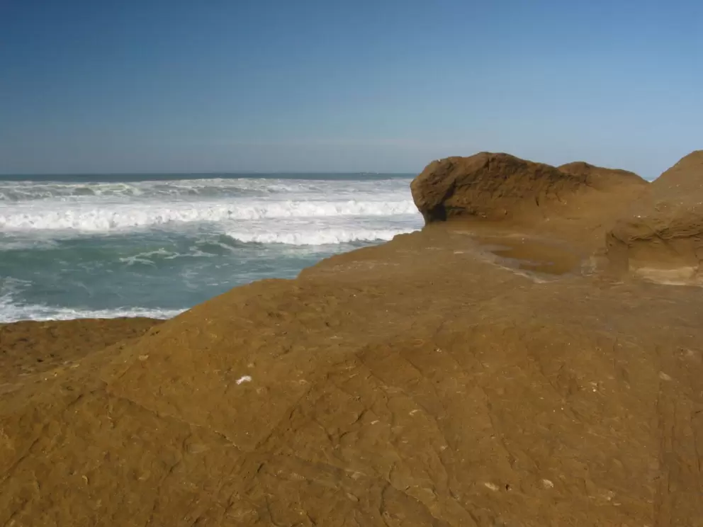 The color of the rock is a striking at Pescadero State Beach.