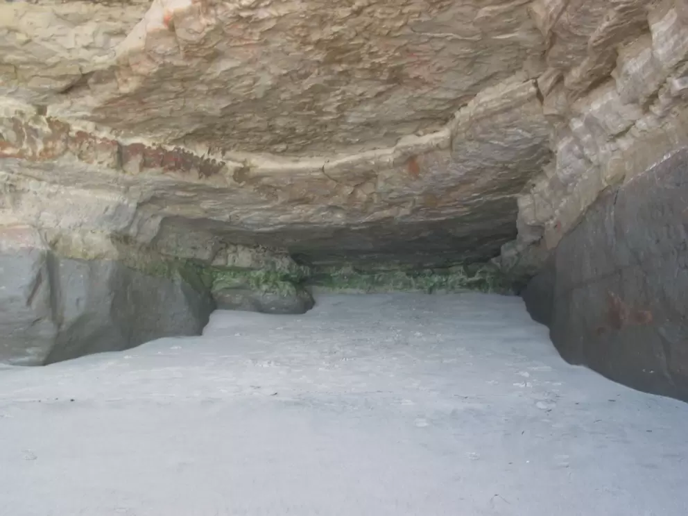 The cave where you can stand and hope not to get caught when the waves come tumbling in.