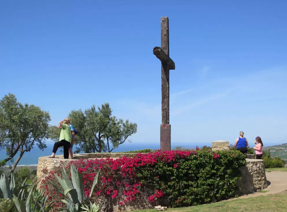 The cross, bougainvillea, and lookout.