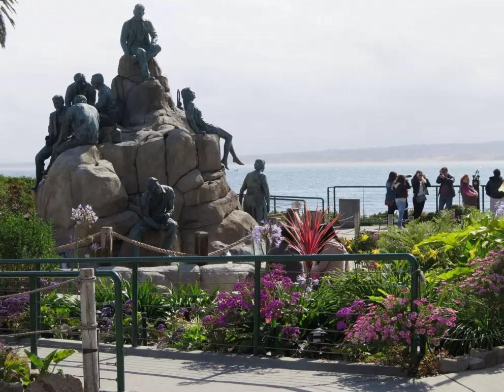 Statue by the water.