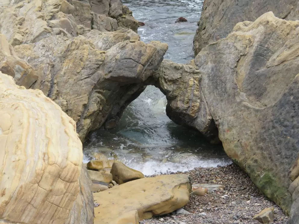Little arch on the coastline at Point Lobos State Reserve.