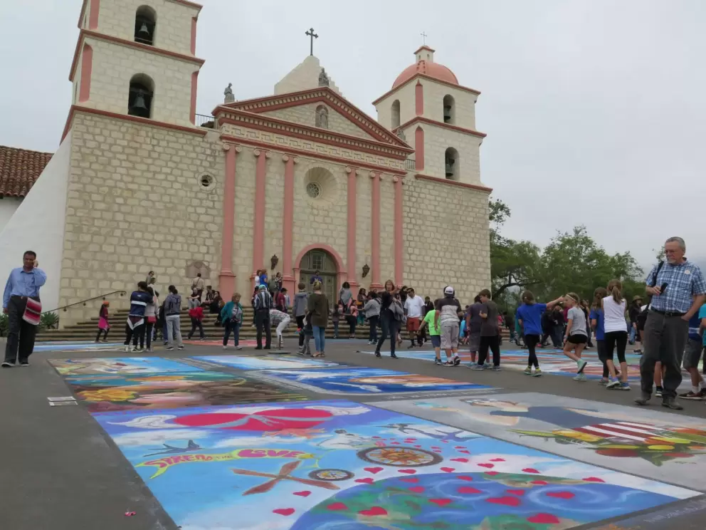 Colorful chalk paintings in front of the mission during the I Madonnari festival.
