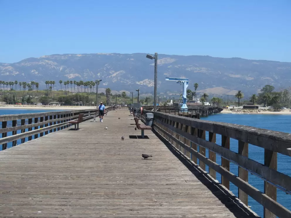 The end of the pier, looking back toward the mountains and beach.