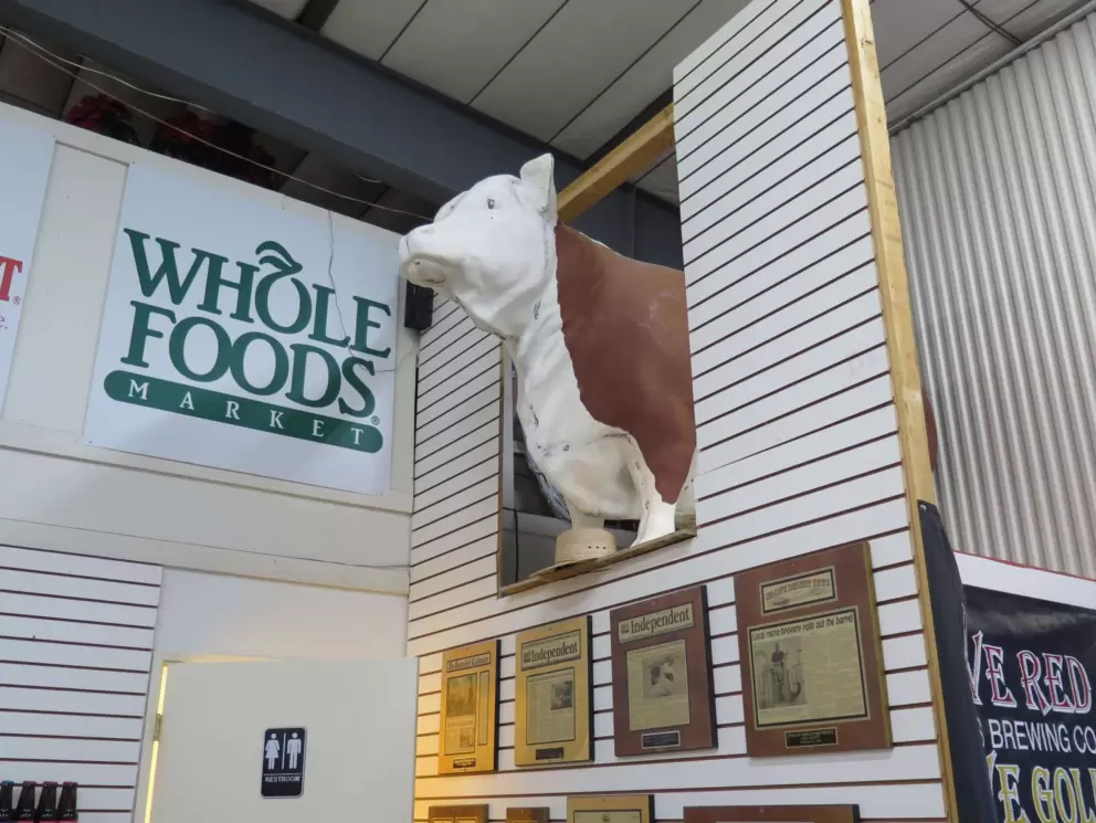 Cow, and whole foods sign.