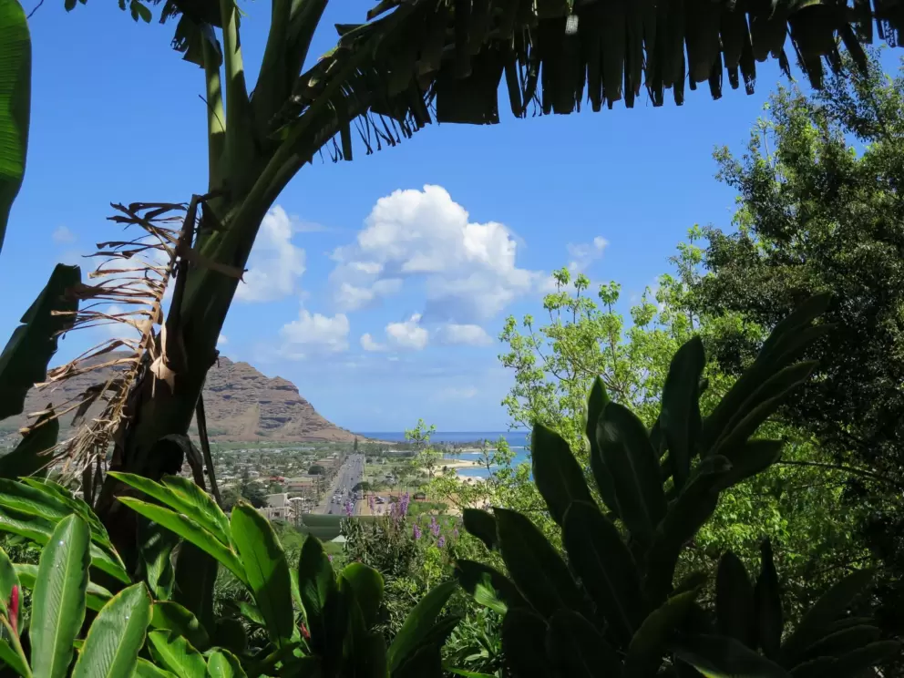 View of the Maili Beach and cute mountain ridge.