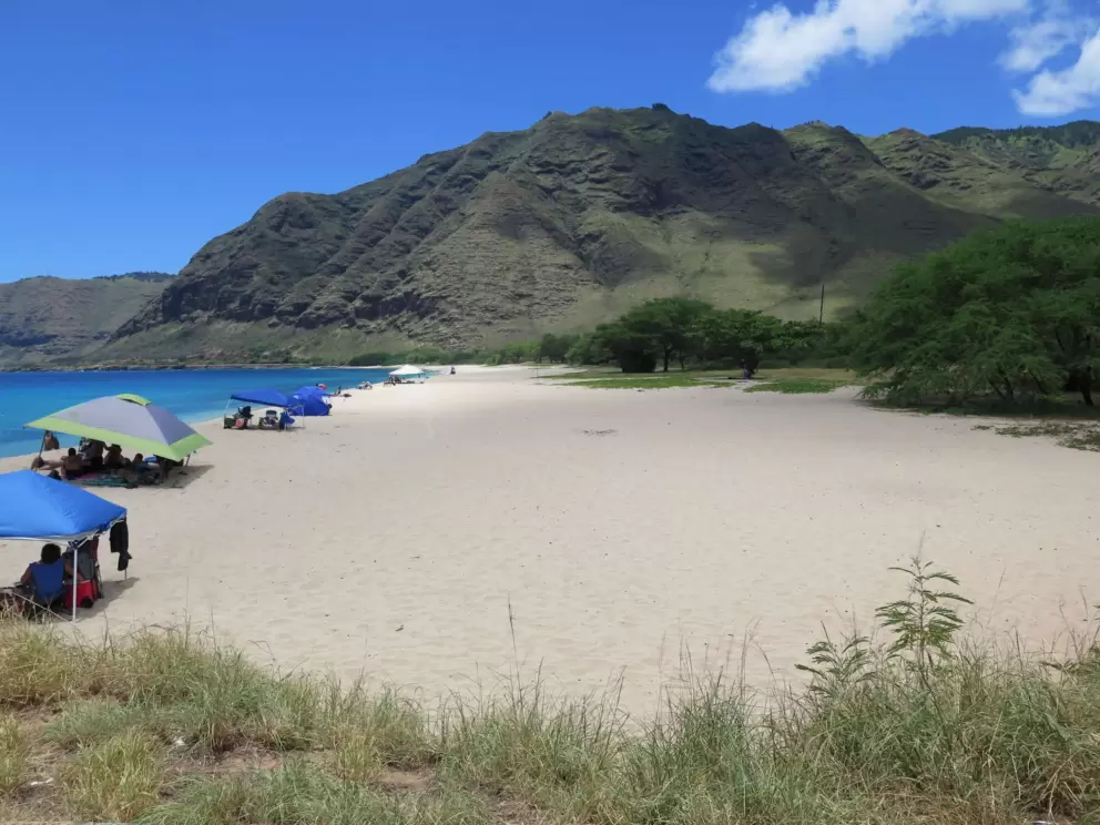 The beach is wide, with amazing mountain views.